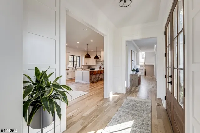 a view of entryway with wooden floor