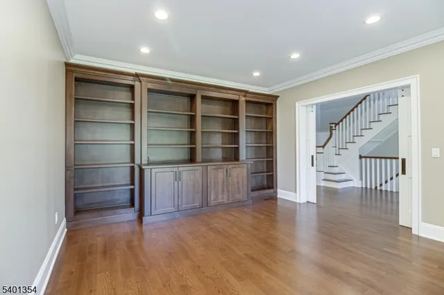 a kitchen that has a lot of cabinets furniture and a window