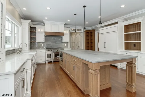 a kitchen with stainless steel appliances granite countertop a stove and a sink