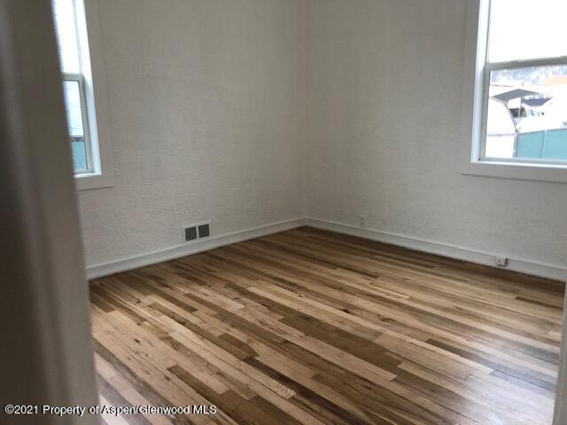 121 West 6th Street Rifle, CO 81650 - Photo 5 of 8 a view of a room with wooden floor and window