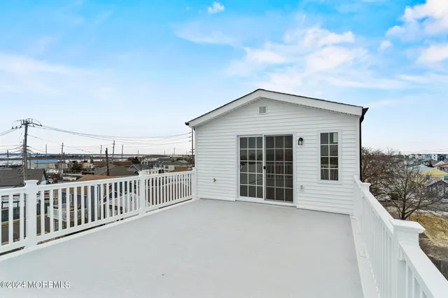 a view of a house with a roof deck