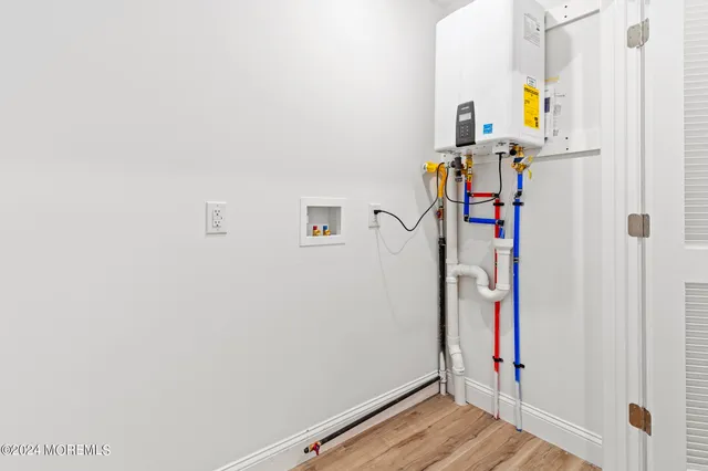 a view of front door and wooden floor