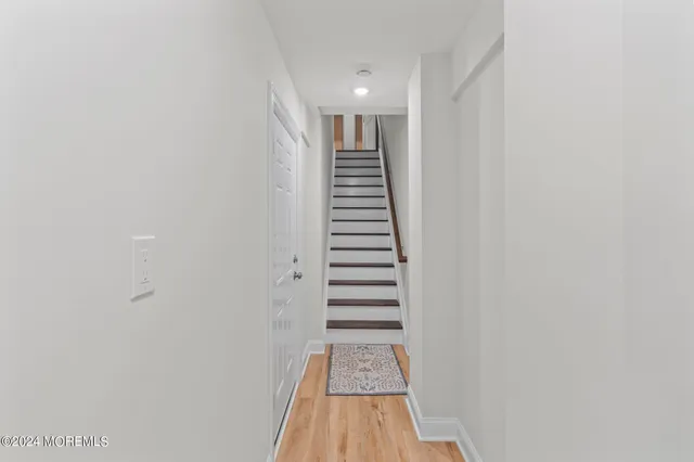 a view of a hallway with stairs