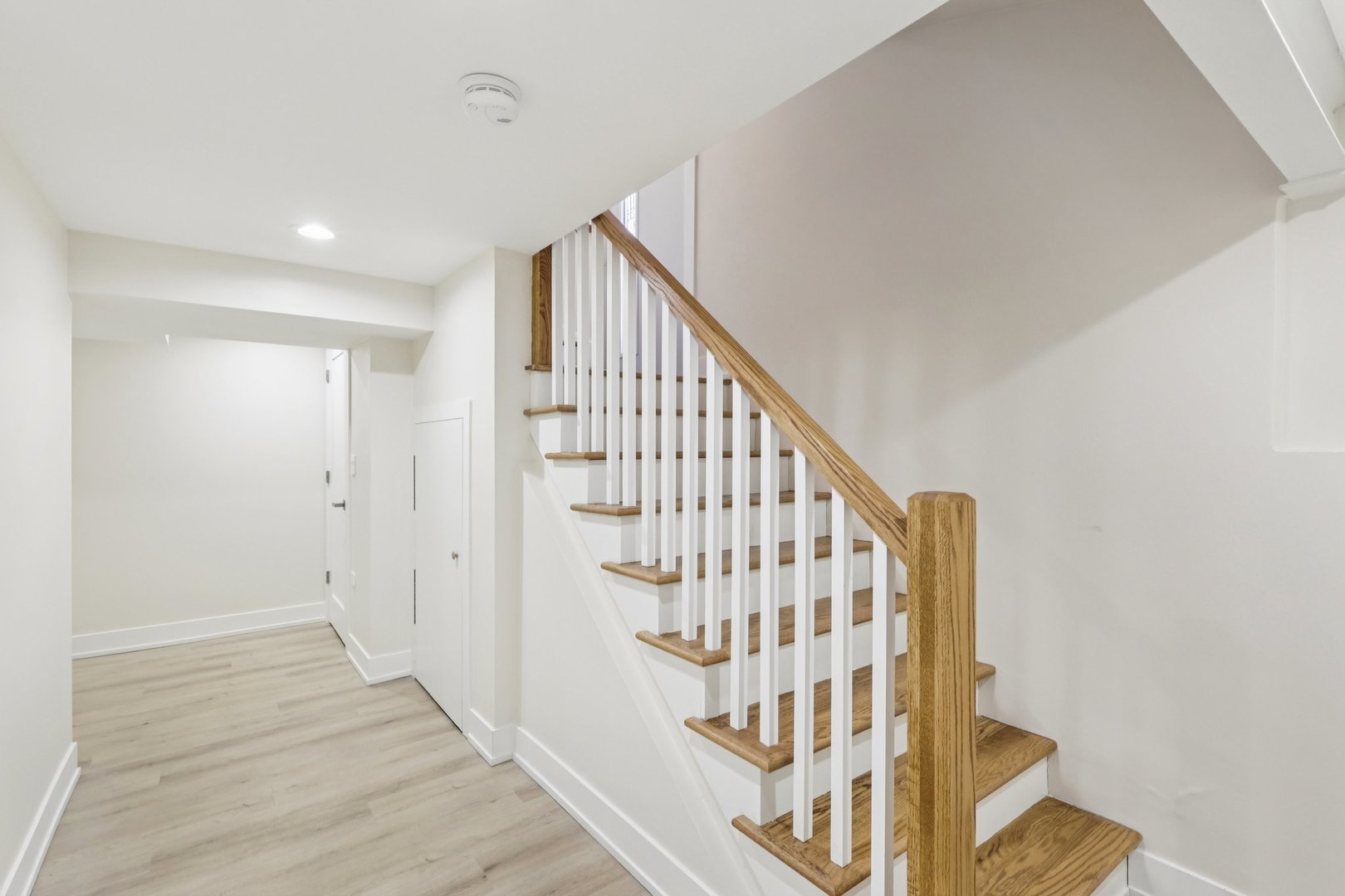 6014 West Fletcher Street Chicago, IL 60634 - Photo 19 of 33 a view of staircase with wooden floor and white walls