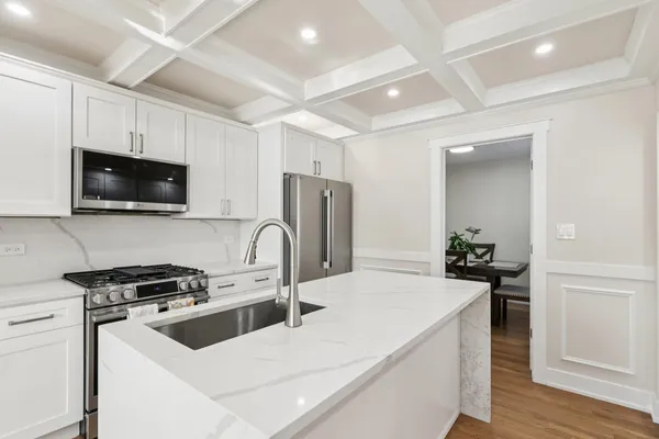 a kitchen with a sink a stove and refrigerator