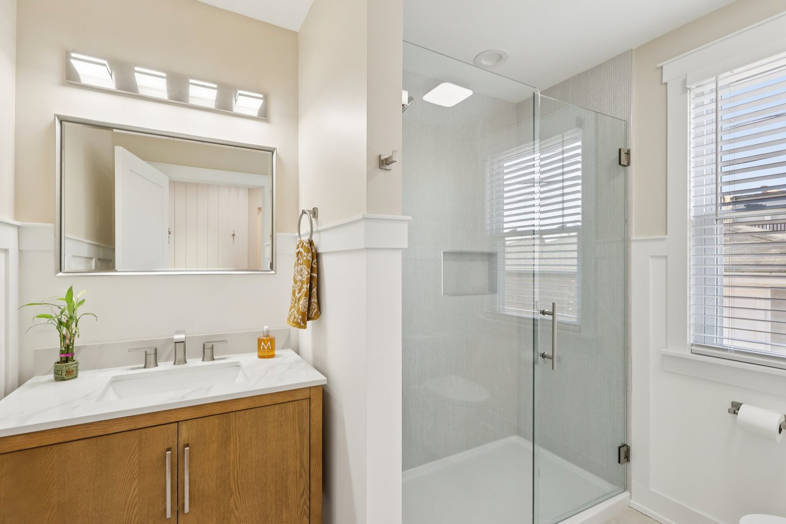 6014 West Fletcher Street Chicago, IL 60634 - Photo 10 of 33 a bathroom with a granite countertop sink mirror and a bathtub