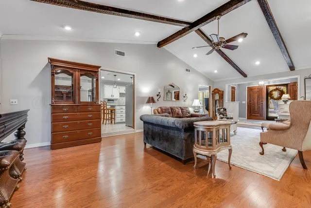 a kitchen with granite countertop a sink stainless steel appliances and cabinets