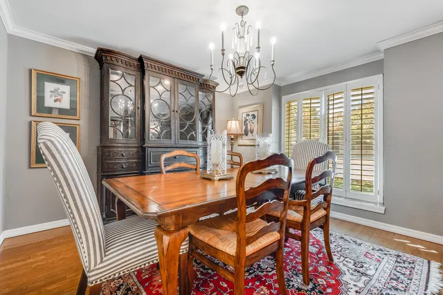 a kitchen with granite countertop stainless steel appliances a sink and cabinets