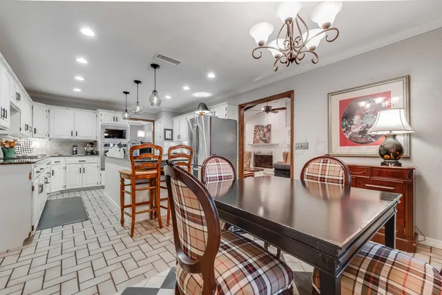 a spacious bedroom with a bed and a dresser