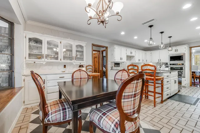 a bathroom with a sink a vanity and a mirror