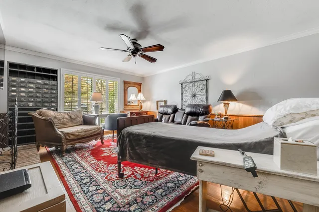 a utility room with stainless steel appliances white cabinets and a sink