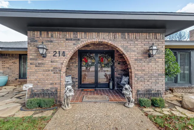 a view of a hallway with front door