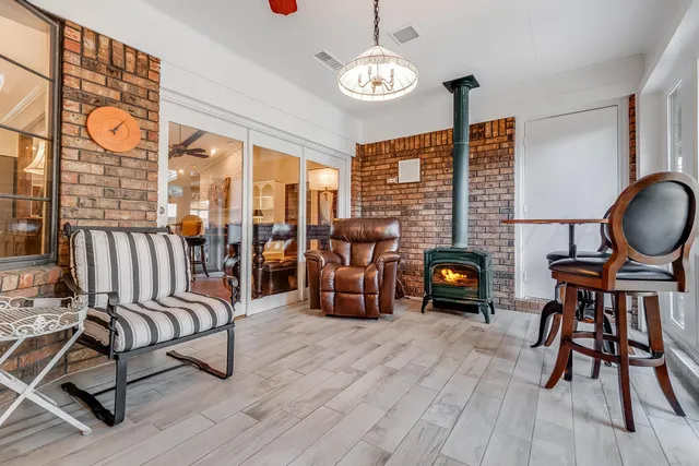 a view of a patio with iron fence