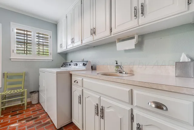 a view of a house with a wooden deck