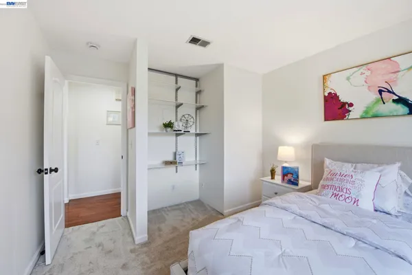 a bedroom with a bed and a view of bathroom