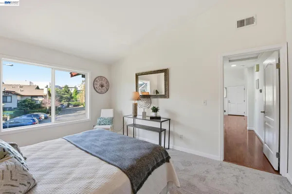 a bedroom with a bed and a table in it