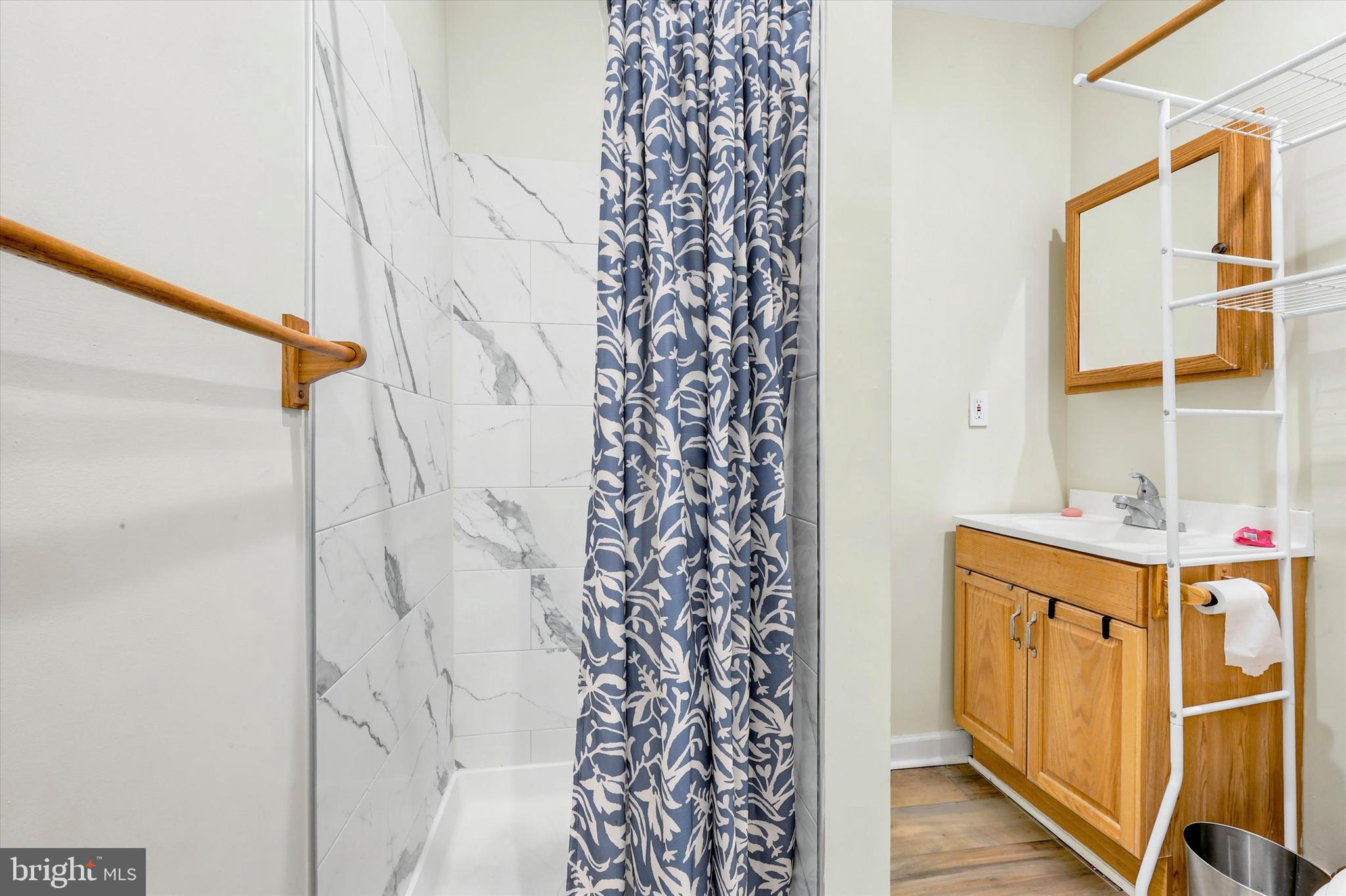 33 South 19th Street Philadelphia, PA 19103 - Photo 8 of 15 a bathroom with a sink and a shower curtain