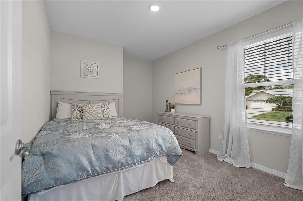 418 Fleming Street Sebastian, FL 32958 - Photo 23 of 38 a bedroom with a bed and a window