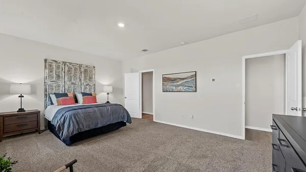 a bedroom with bed and a window