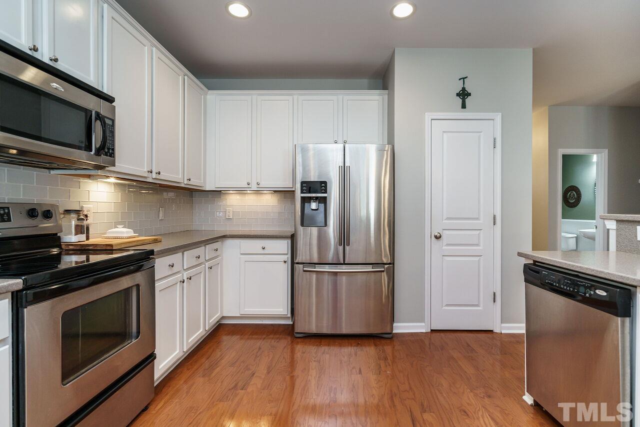 2543 Asher View Court Raleigh, NC 27606 - Photo 13 of 30 There is abundant counter and cabinet storage in this great space.