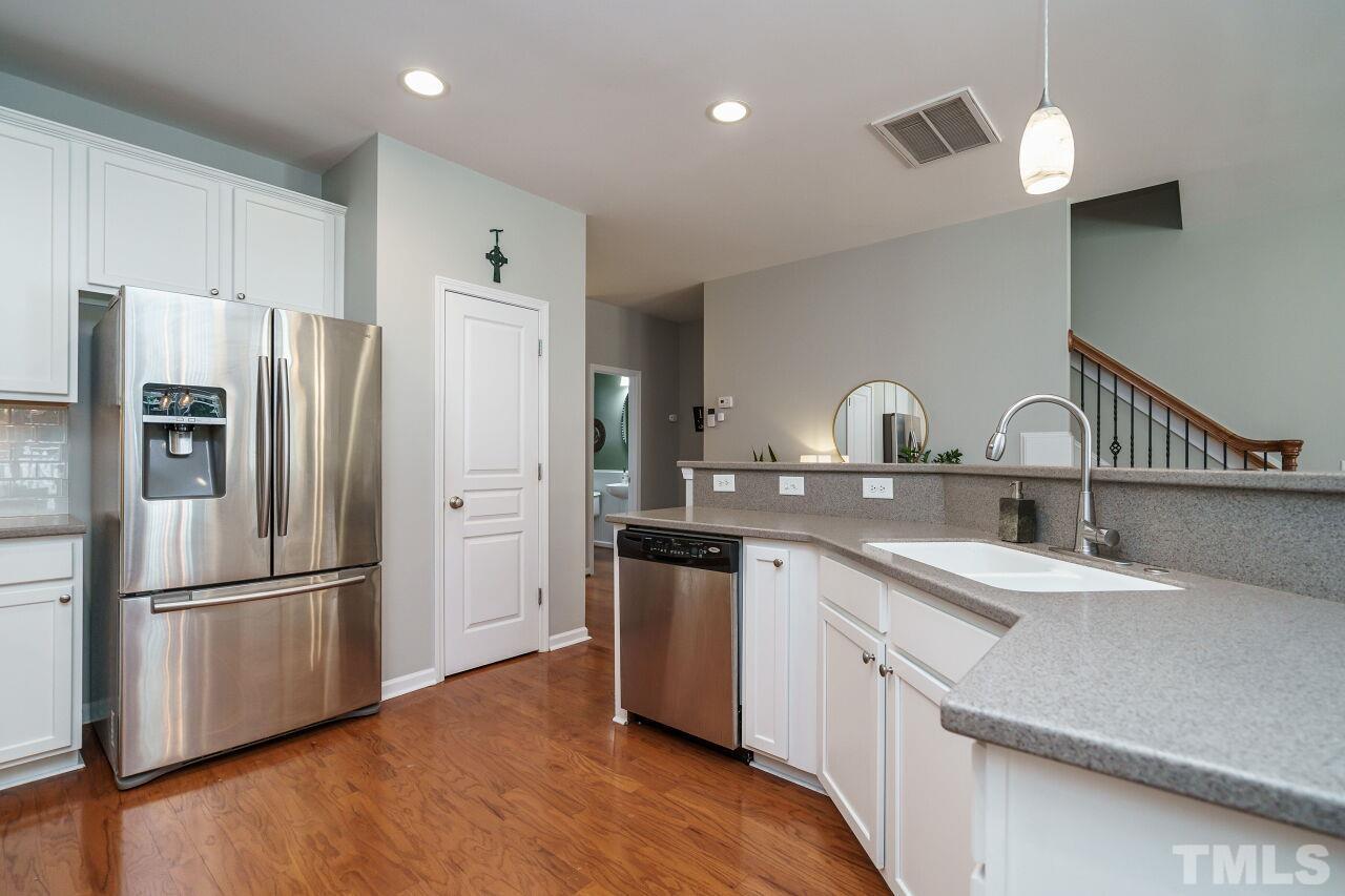 2543 Asher View Court Raleigh, NC 27606 - Photo 14 of 30 In addition to great storage space in the kitchen there is also a pantry.