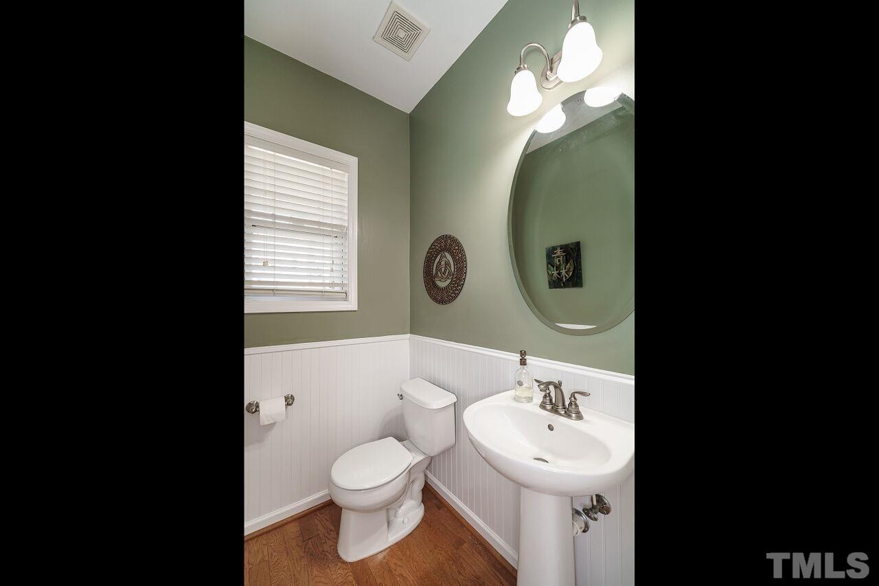 2543 Asher View Court Raleigh, NC 27606 - Photo 16 of 30 The half-bath is conveniently located on the first floor.