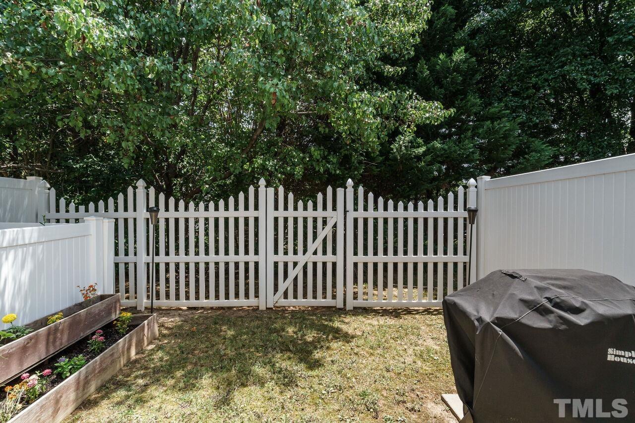 2543 Asher View Court Raleigh, NC 27606 - Photo 28 of 30 There's a grassy area for all to enjoy.
