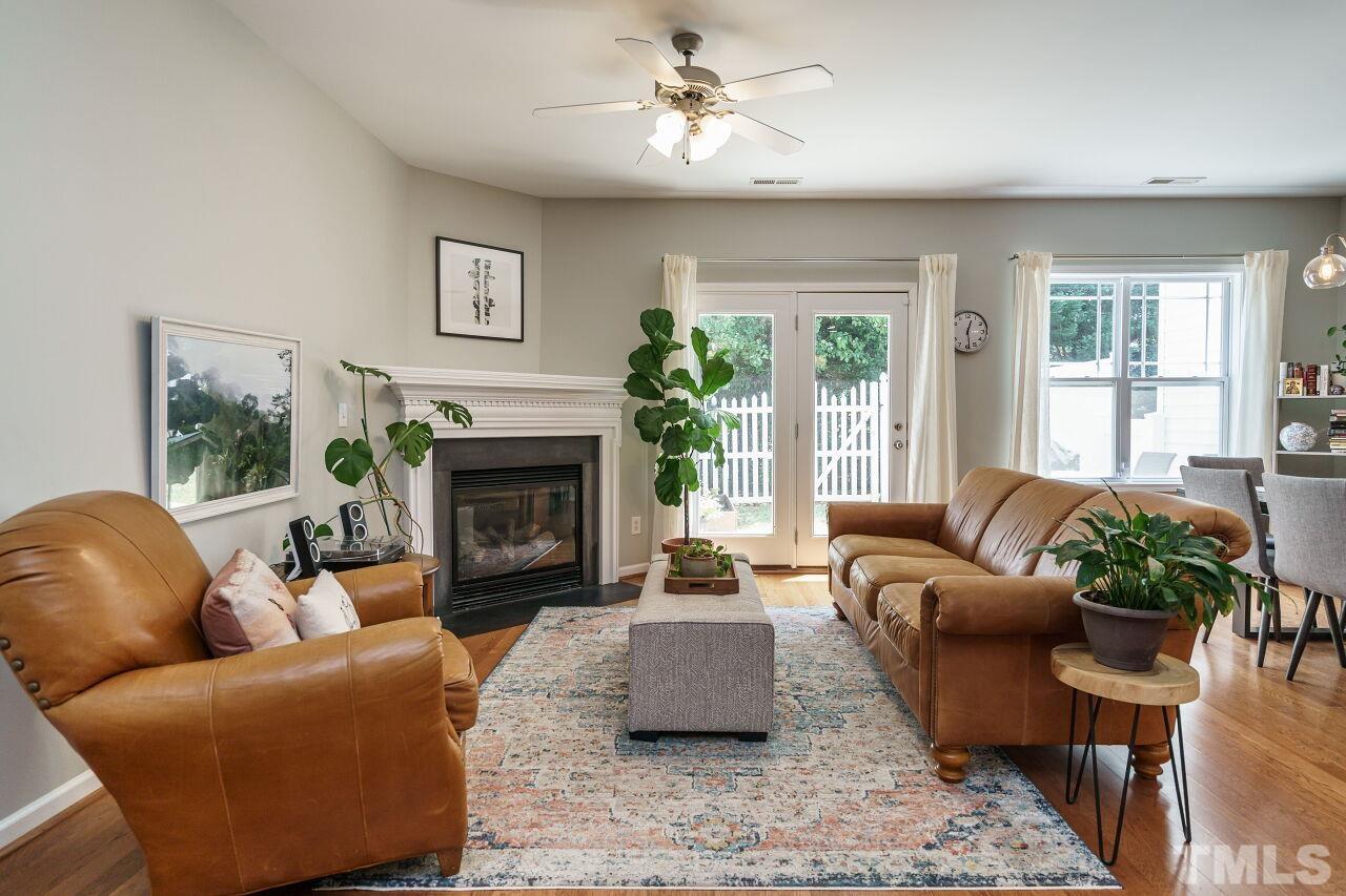 2543 Asher View Court Raleigh, NC 27606 - Photo 5 of 30 Friends and family will enjoy spending time by the fireplace on cool North Carolina days.