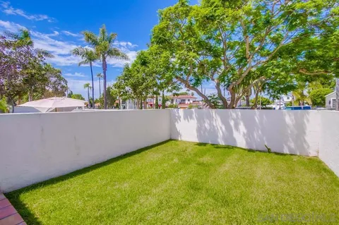 a view of a livingroom with furniture and a window