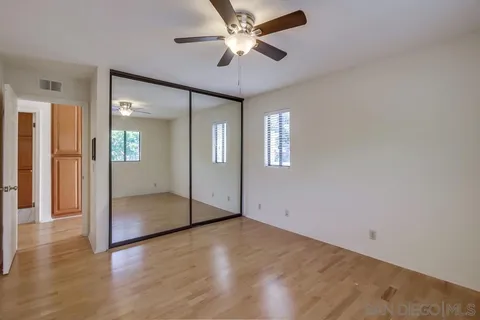 a room with a wooden floor and furniture