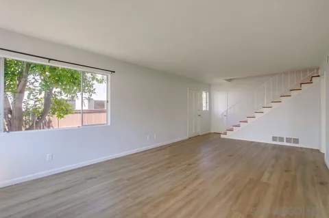 an aerial view of a houses with a yard