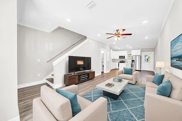 a living room with furniture and a flat screen tv