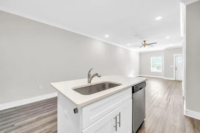 a kitchen with a sink and a refrigerator