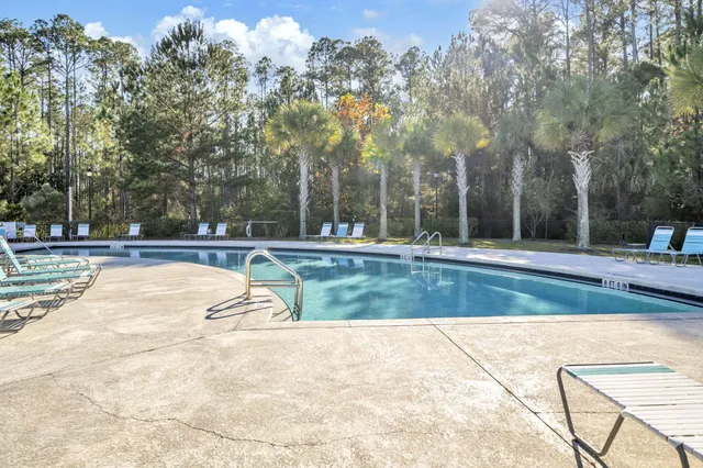 a view of backyard with swimming pool