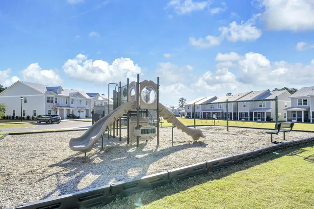 a view of a swimming pool with a lounge chair