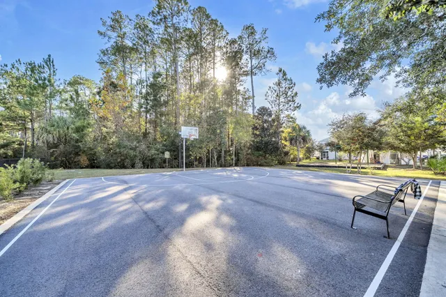 a view of outdoor space with swimming pool and trees
