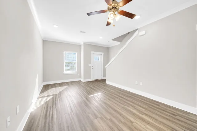 wooden floor in an empty room with a window
