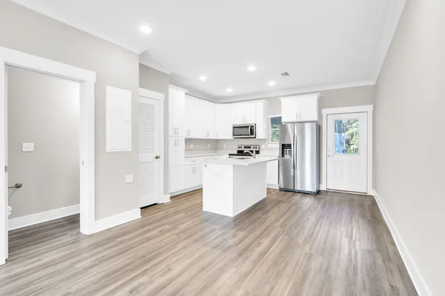 a view of kitchen with wooden floor