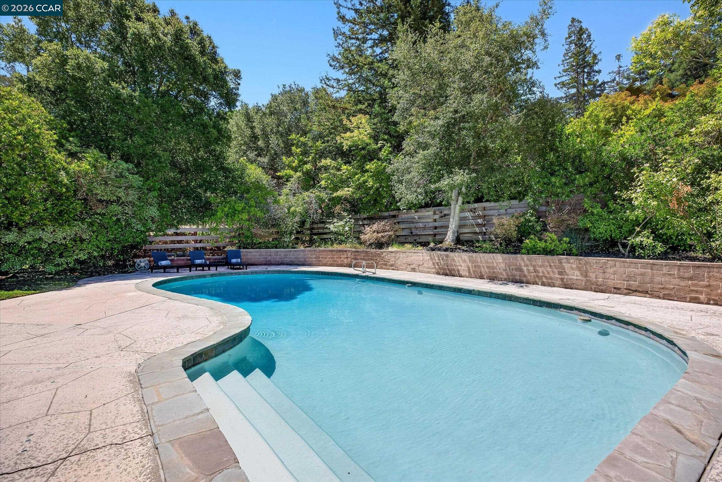 3365 St Marys Road Lafayette, CA 94549 - Photo 22 of 27 a view of a swimming pool with a patio