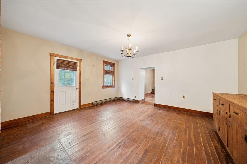 41 Columbia Road Monongahela, PA 15063 - Photo 16 of 37 an empty room with wooden floor chandelier and windows