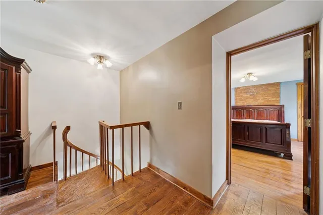 a bathroom with a sink a toilet and a window