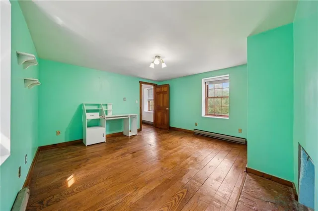 a view of a room with window and stairs