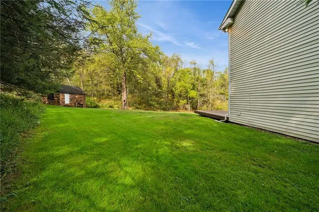 a view of a big yard with a fountain