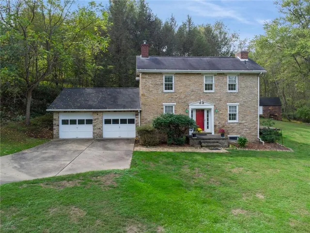 a view of a house with a yard porch and sitting area