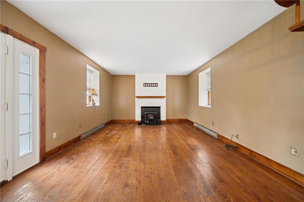 41 Columbia Road Monongahela, PA 15063 - Photo 9 of 37 a view of empty room with wooden floor and fireplace
