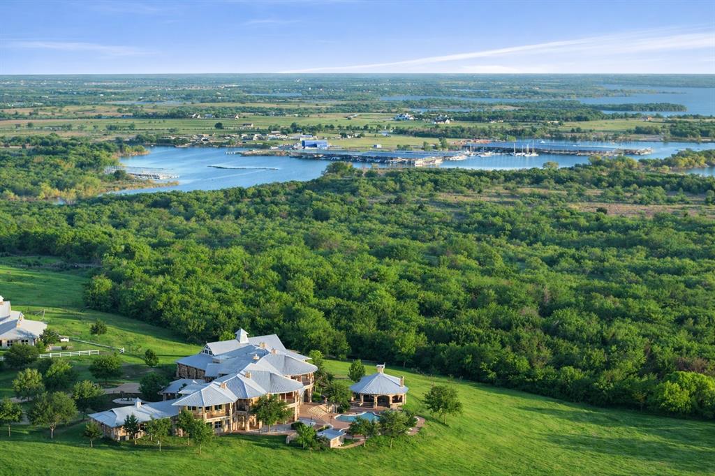 1180 McReynolds Road Sanger, TX 76266 - Photo 37 of 40 Expansive estate featuring multiple structures, a manicured lawn, and mature trees