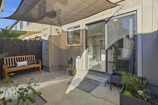 a view of porch with a bench and wooden floor