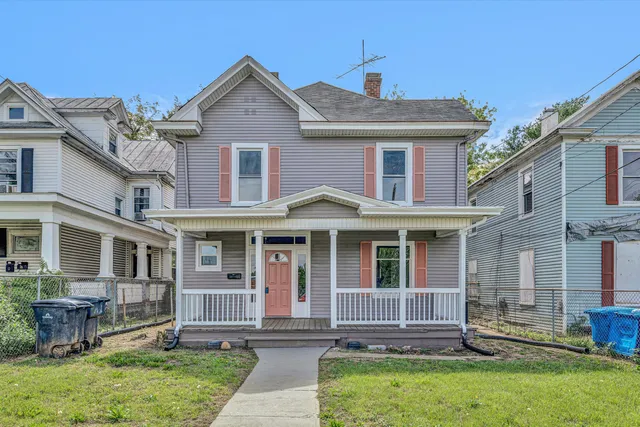 front view of a house with a yard