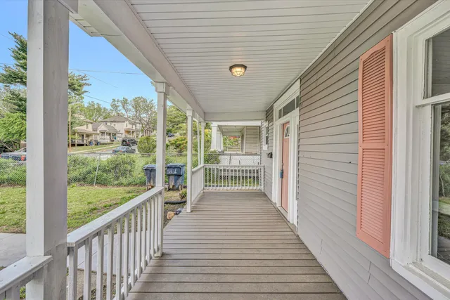 a view of a porch with wooden floor and outdoor space