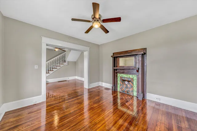 a view of an empty room and wooden floor